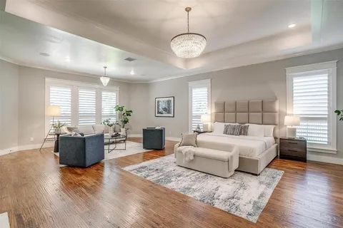 a spacious bedroom with a large bed and a couch