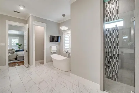 a bathroom with a toilet sink and shower