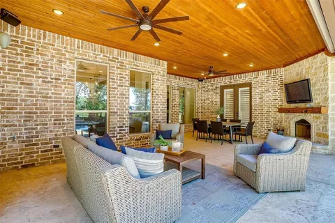 a view of a patio with swimming pool table and chairs