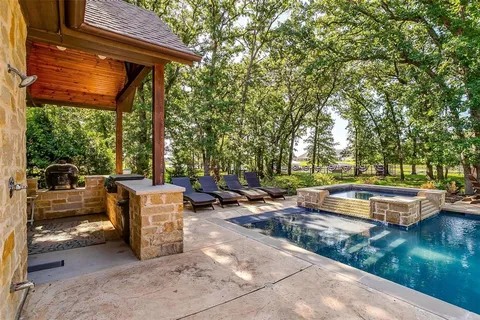 a view of swimming pool with chairs