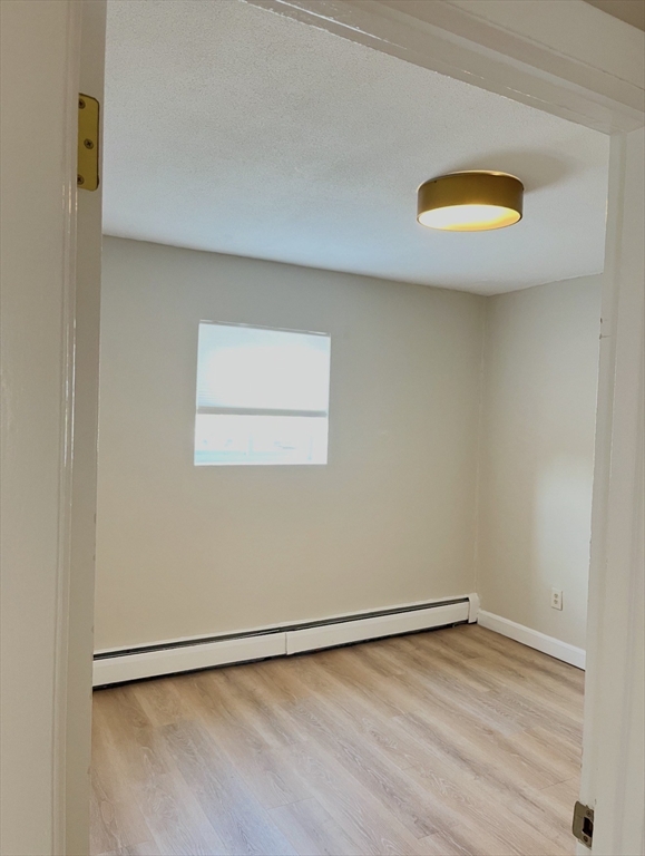22 Westgate Road, Unit 3 Boston, MA 02467 - Photo 10 of 18 a view of an empty room