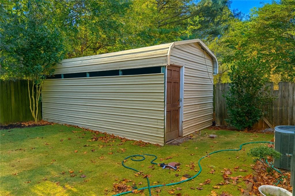 1070 Daventry Crossing Woodstock, GA 30188 - Photo 20 of 20 a view of house with backyard and garage