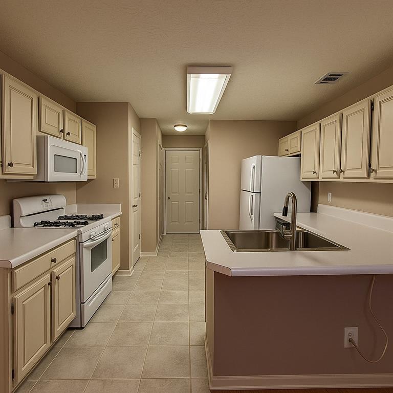 1070 Daventry Crossing Woodstock, GA 30188 - Photo 6 of 20 a kitchen with stainless steel appliances granite countertop a sink stove and cabinets