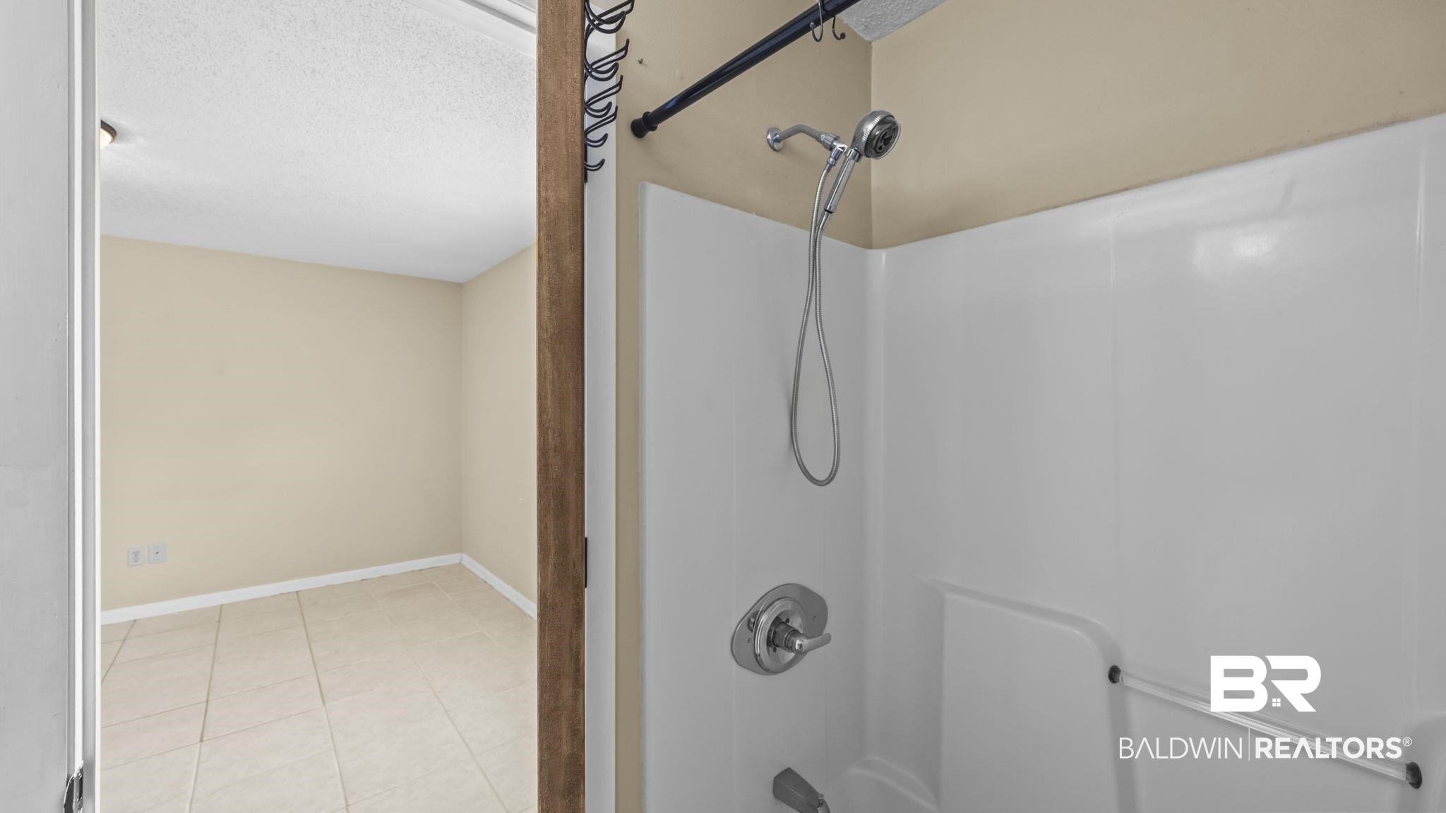 15096 Highland Circle Foley, AL 36535 - Photo 30 of 52 Bathroom featuring a white shower/tub combination with chrome fixtures and a handheld shower head