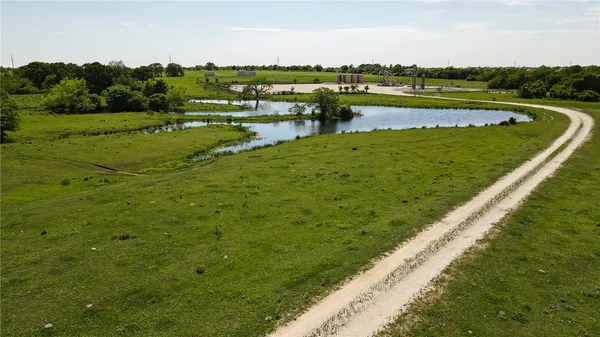a view of a lake with a big yard