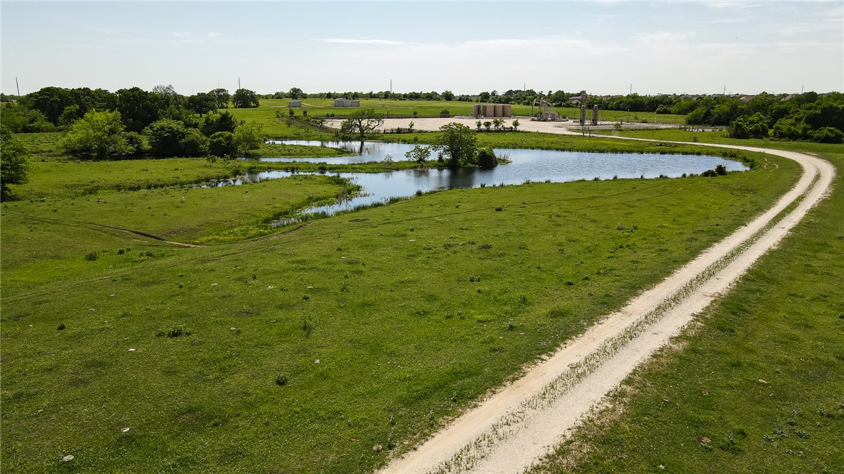 2587 JOLENE Trail Bryan, TX 77808 - Photo 2 of 7 a view of a lake with a big yard