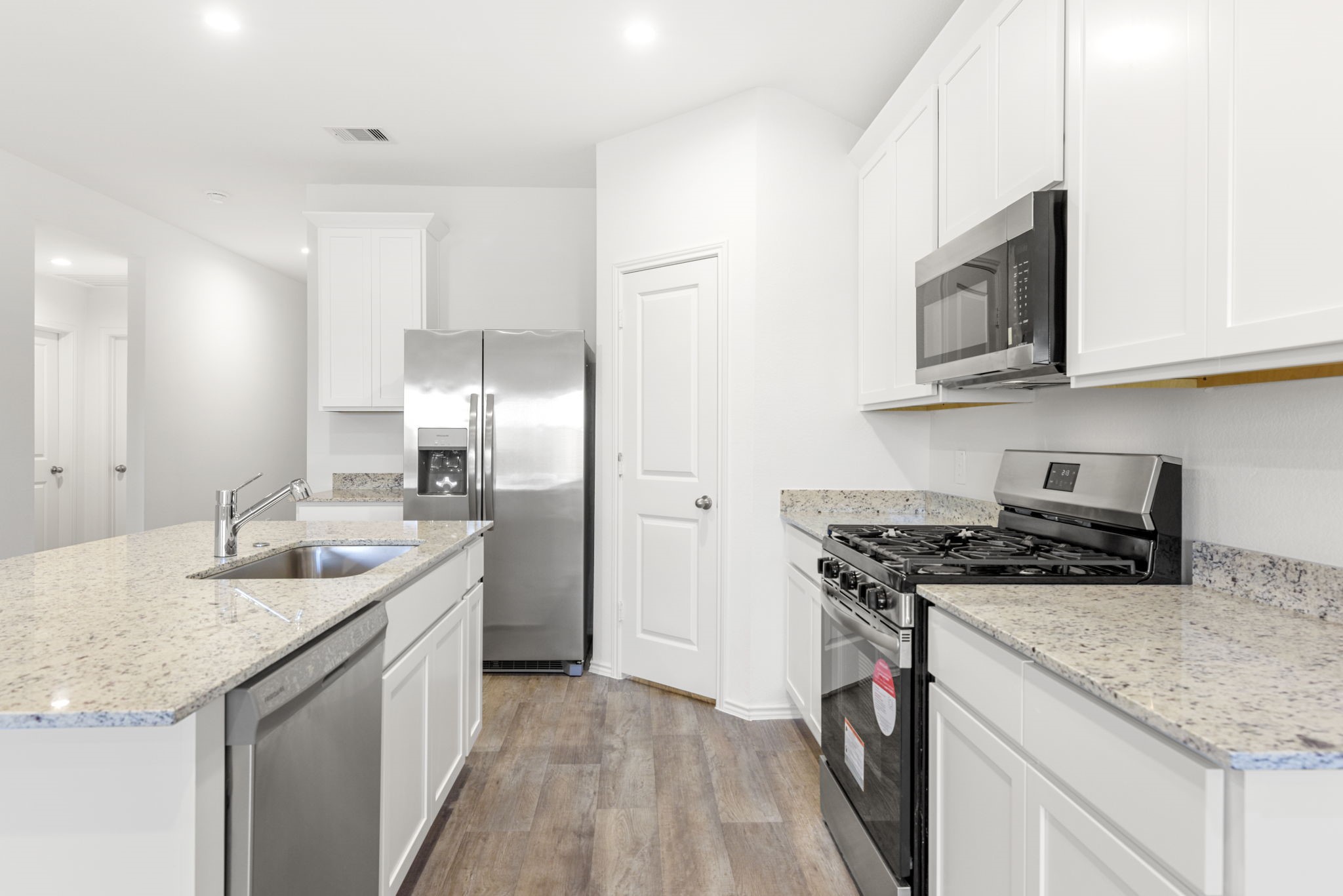 30906 Rockstock Road Fulshear, TX 77441 - Photo 1 of 43 a kitchen with stainless steel appliances granite countertop a sink stove and refrigerator
