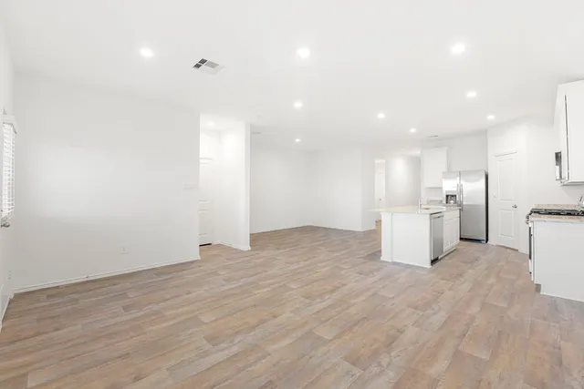 a view of kitchen with wooden floor