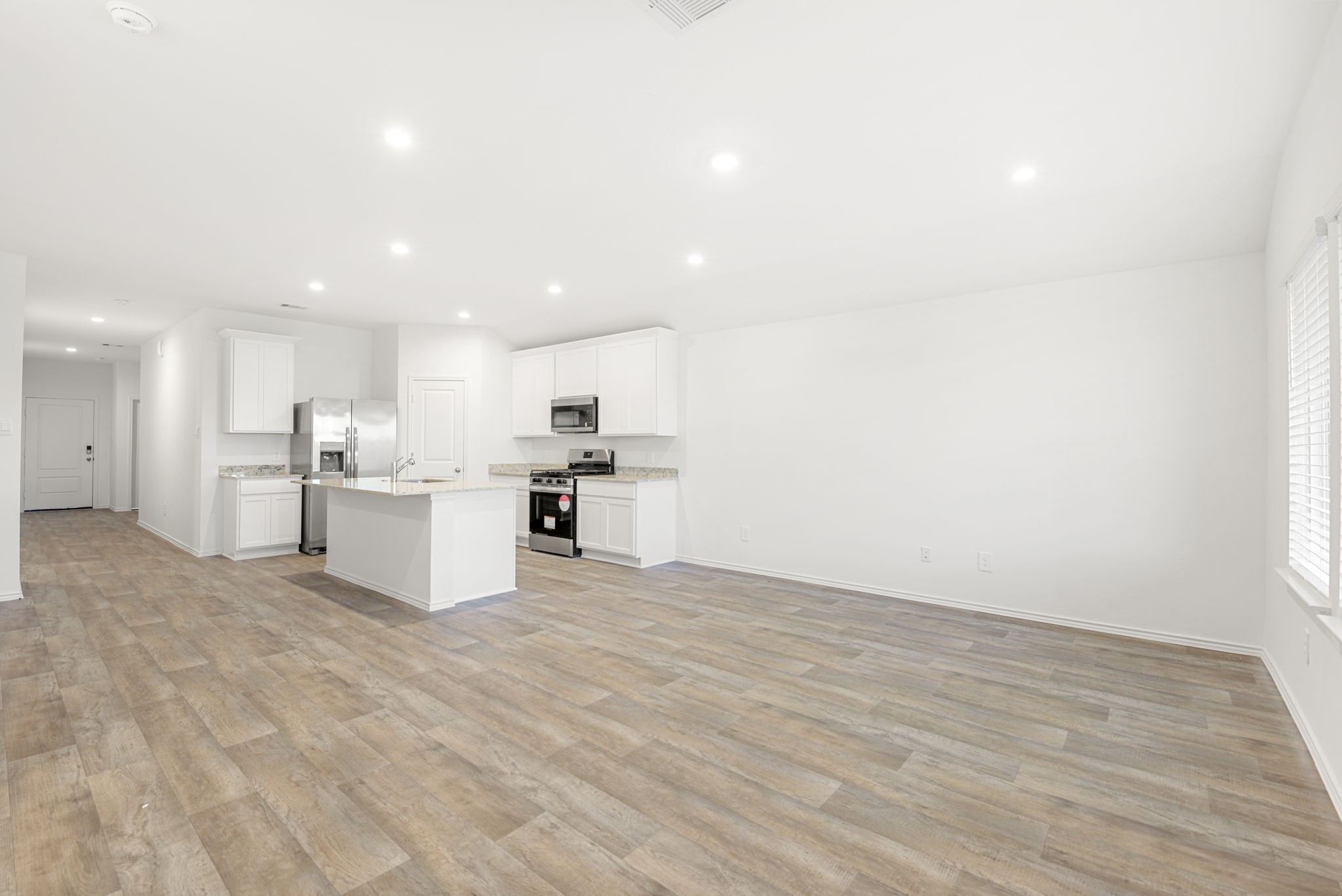 30906 Rockstock Road Fulshear, TX 77441 - Photo 19 of 43 a view of kitchen with wooden floor