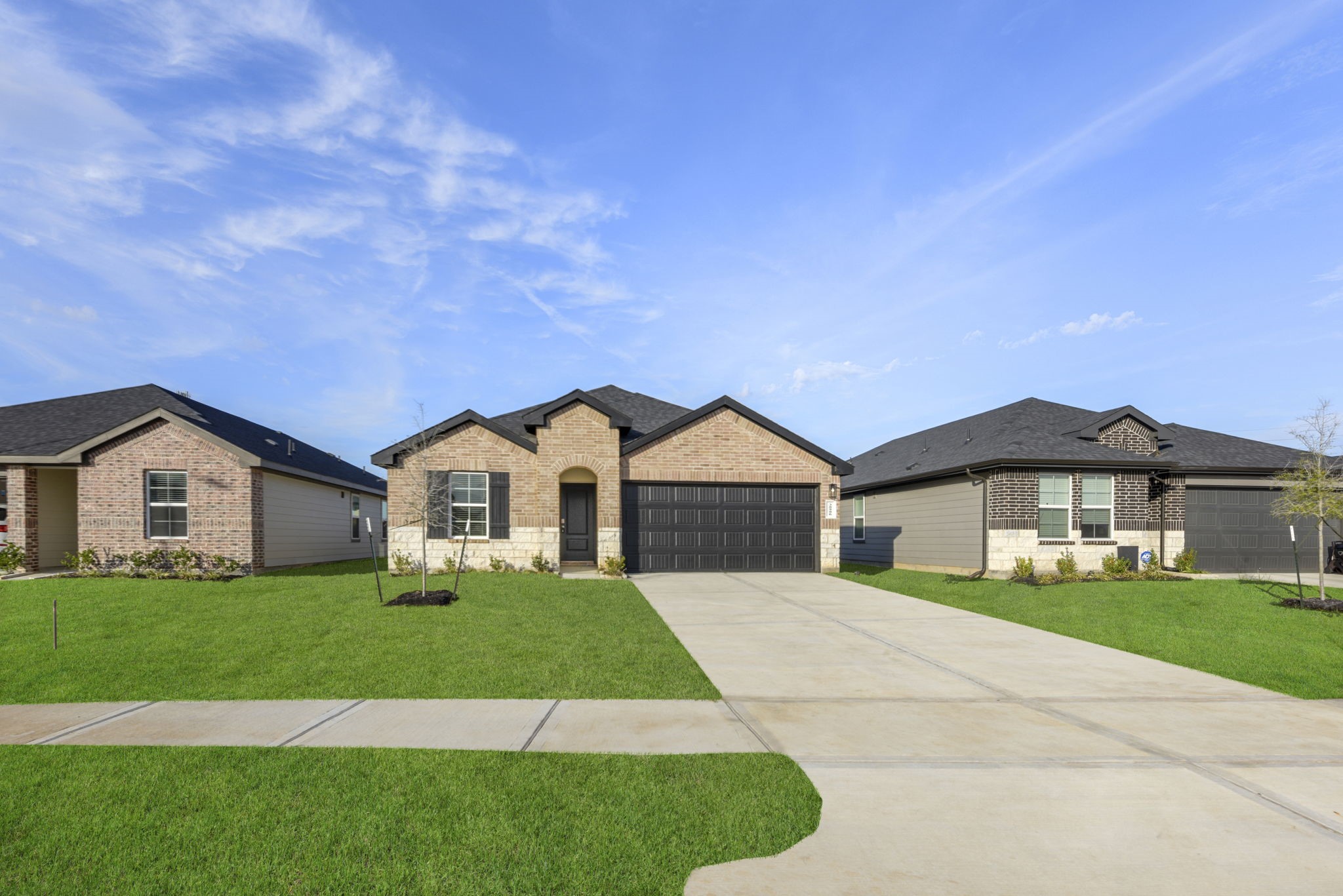 30906 Rockstock Road Fulshear, TX 77441 - Photo 2 of 43 a front view of a house with a yard and garage