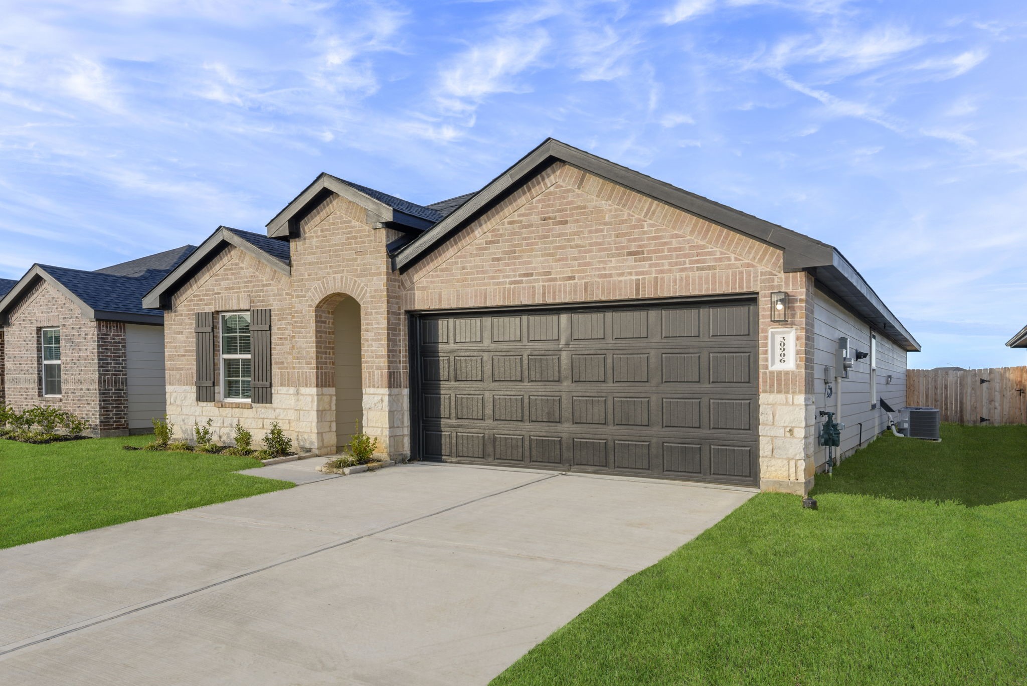 30906 Rockstock Road Fulshear, TX 77441 - Photo 3 of 43 a front view of a house with a yard and garage