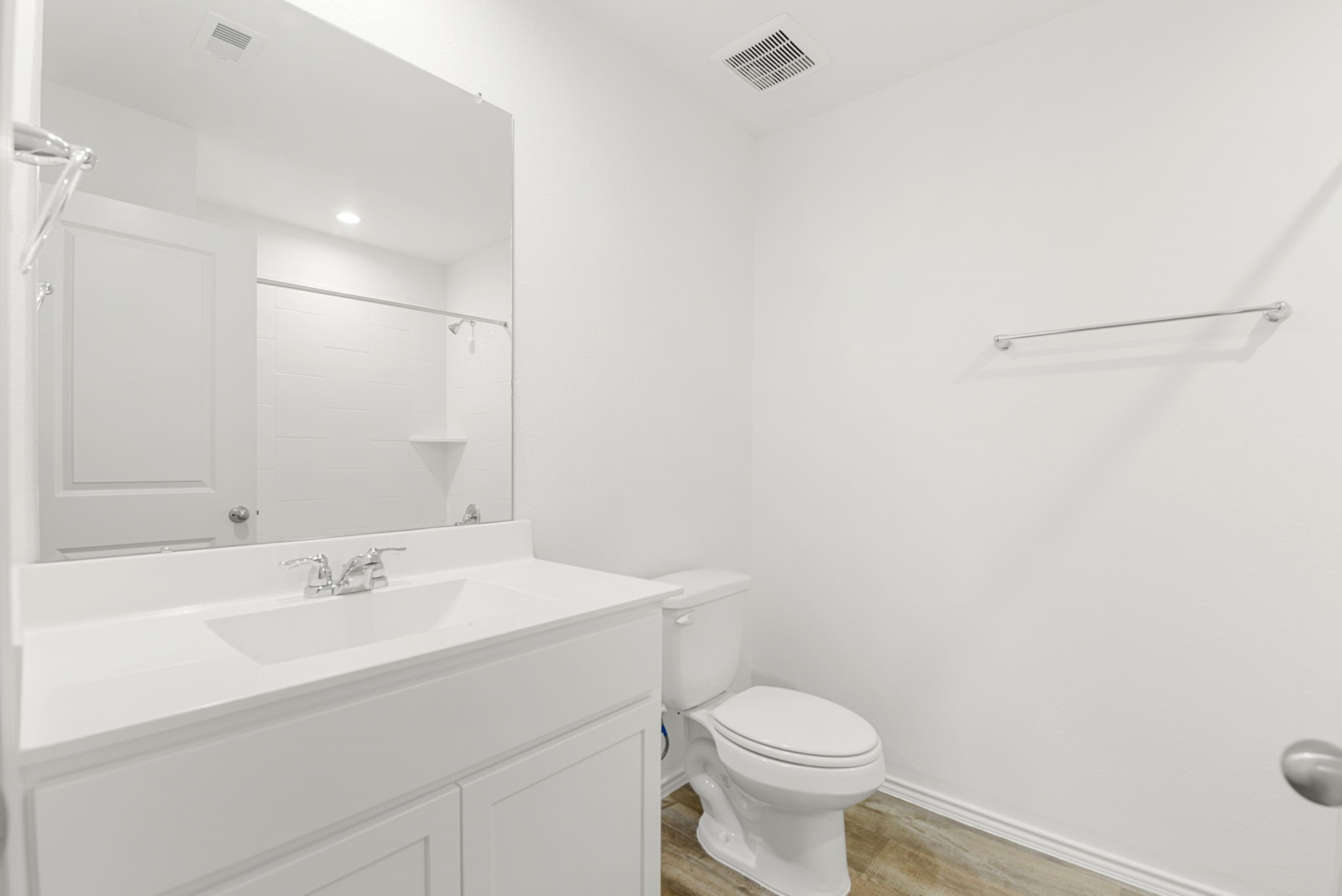 30906 Rockstock Road Fulshear, TX 77441 - Photo 36 of 43 a bathroom with a sink a toilet and a mirror