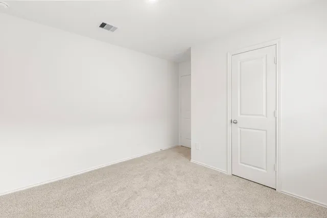 a view of a backyard with grass