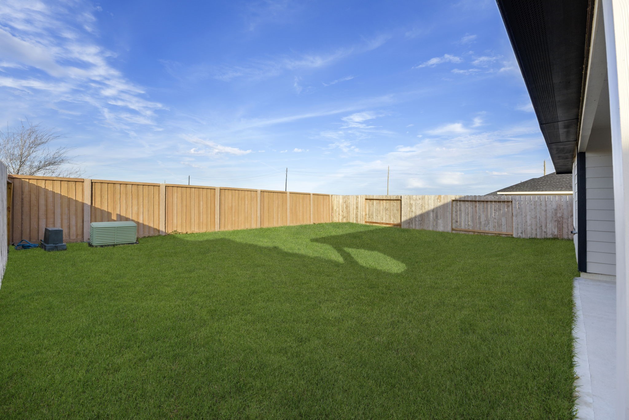 30906 Rockstock Road Fulshear, TX 77441 - Photo 41 of 43 a view of a backyard with grass