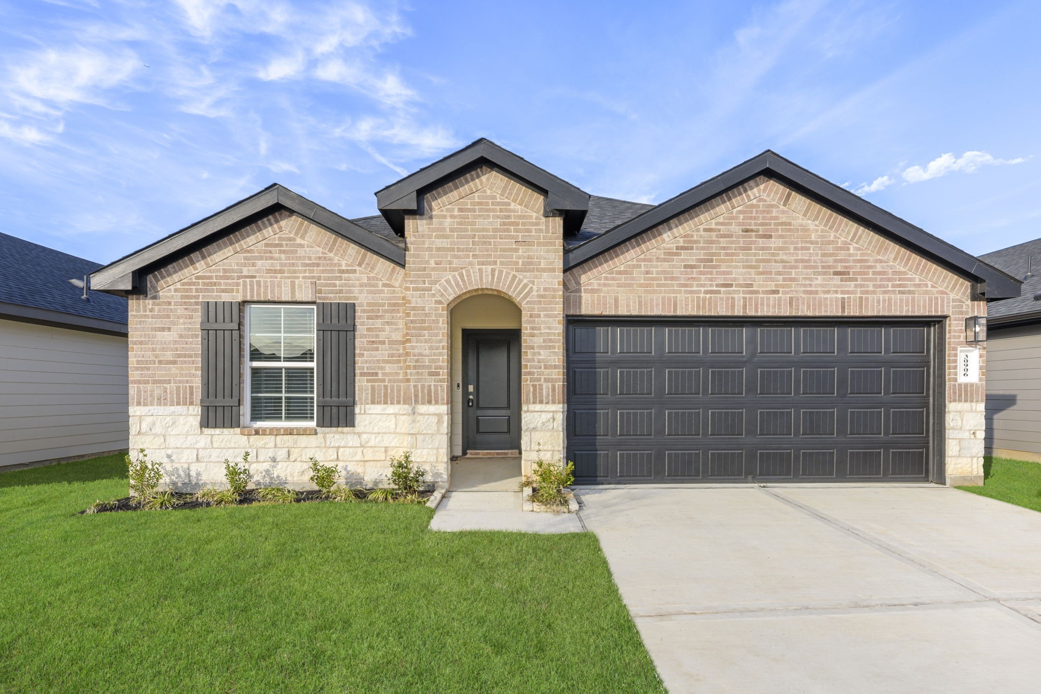 30906 Rockstock Road Fulshear, TX 77441 - Photo 5 of 43 a front view of a house with a yard and garage