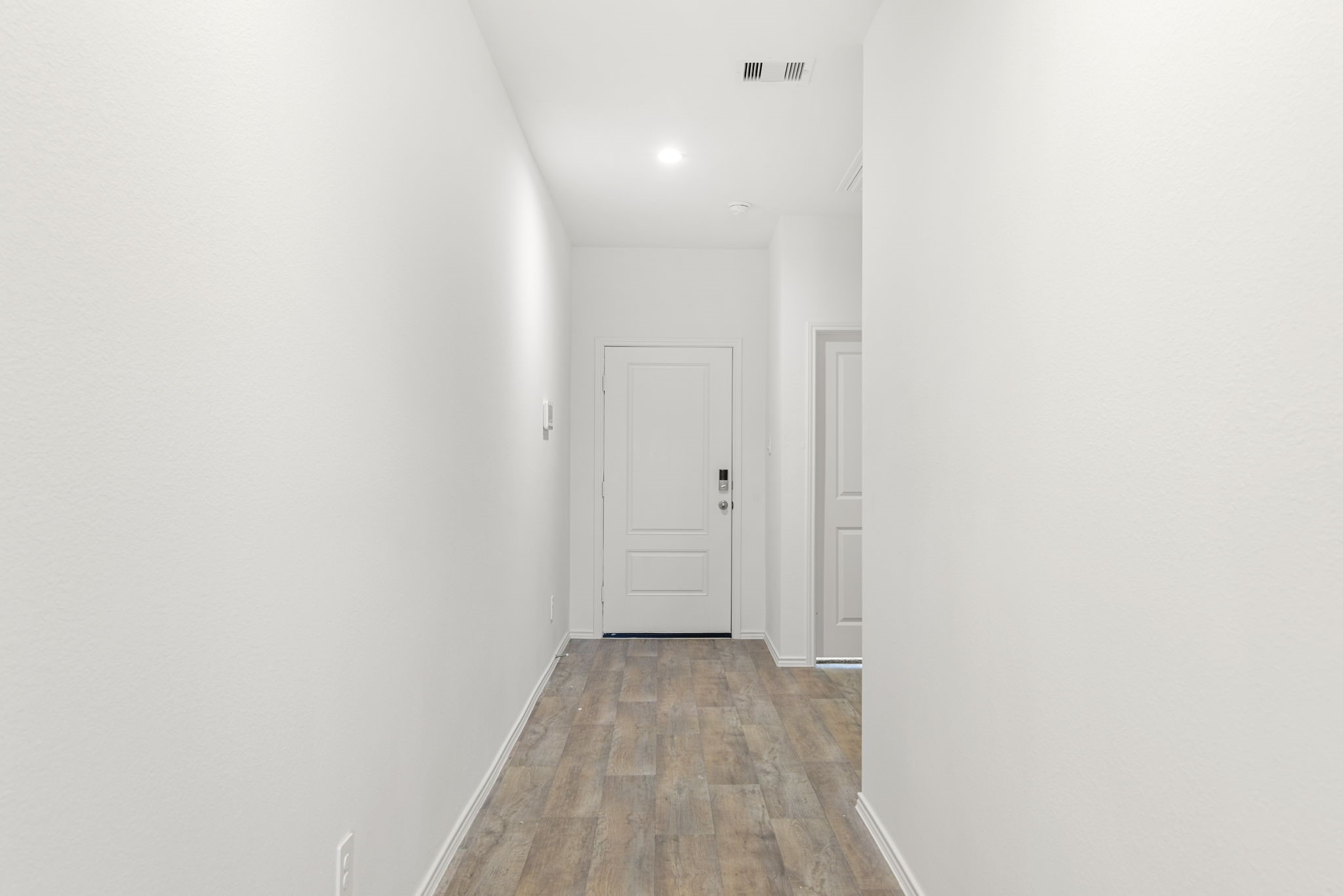 30906 Rockstock Road Fulshear, TX 77441 - Photo 7 of 43 a view of a room with wooden floor and a bathroom