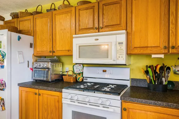 a kitchen with stainless steel appliances granite countertop a sink and a window