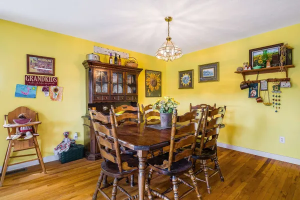 a view of a porch with furniture and floor to ceiling window