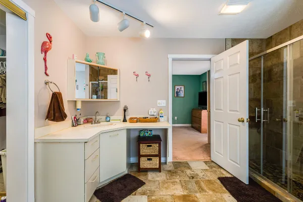 a bed room with a bed and a dresser