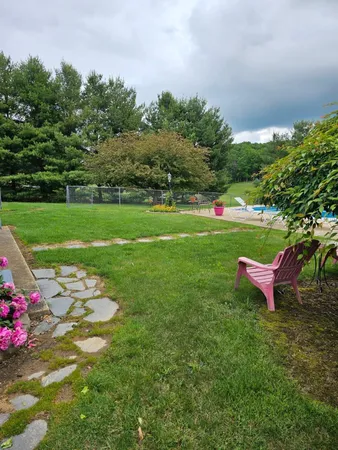 a balcony with furniture and a potted plant