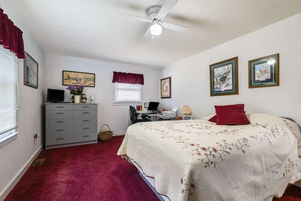 a bathroom with a sink toilet vanity and shower