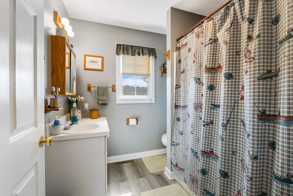 a living room with furniture and large windows