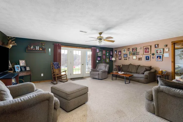 a view of a chairs and table in a room