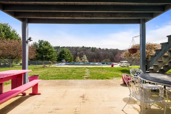 a view of a swimming pool and lounge chair