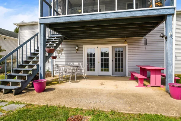 a view of a swimming pool with an outdoor seating