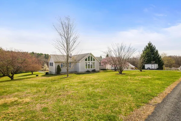 a view of a house with a yard