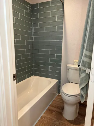 a view of a backyard with wooden fence