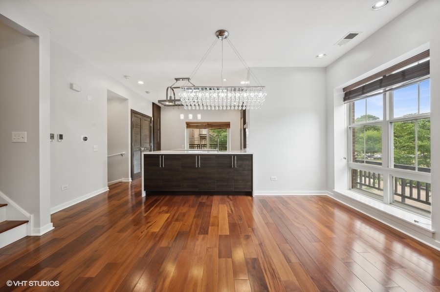 1231 West Arthington Street Chicago, IL 60607 - Photo 13 of 34 a living room with a bed furniture and a window