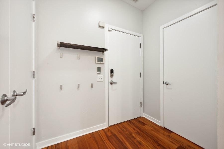 1231 West Arthington Street Chicago, IL 60607 - Photo 18 of 34 a view of a hallway with wooden floor