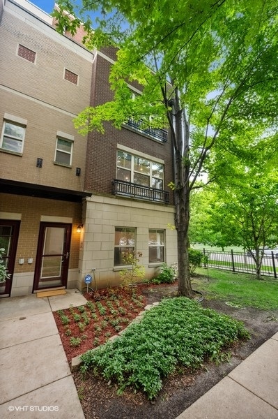 1231 West Arthington Street Chicago, IL 60607 - Photo 2 of 34 a front view of a house with garden