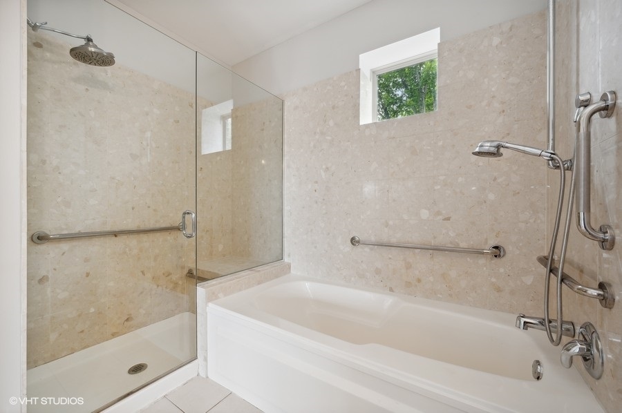 1231 West Arthington Street Chicago, IL 60607 - Photo 23 of 34 a bathroom with a bathtub and a shower