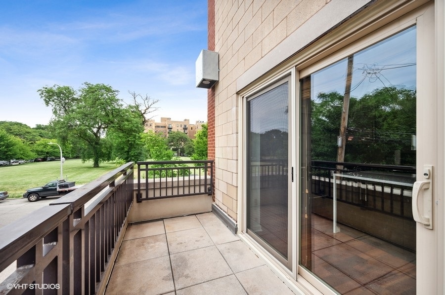 1231 West Arthington Street Chicago, IL 60607 - Photo 32 of 34 a view of a balcony with wooden floor