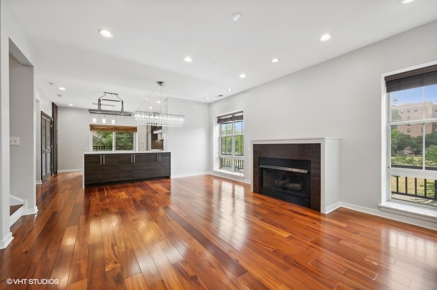 1231 West Arthington Street Chicago, IL 60607 - Photo 6 of 34 a view of kitchen and hall with wooden floor