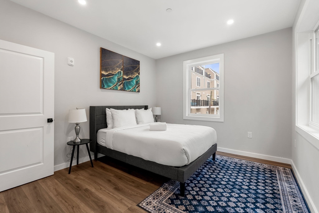 59 Perrin Street, Unit 1 Boston, MA 02119 - Photo 15 of 33 a bedroom with a bed and a window