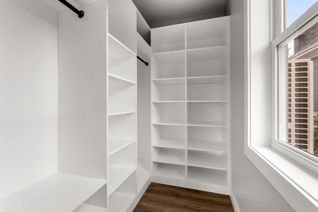 59 Perrin Street, Unit 1 Boston, MA 02119 - Photo 17 of 33 a view of walk in closet with empty racks