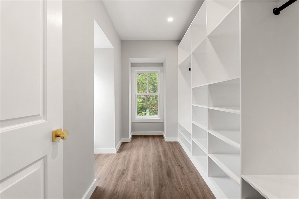 59 Perrin Street, Unit 1 Boston, MA 02119 - Photo 21 of 33 a view of a hallway view with wooden floor and staircase