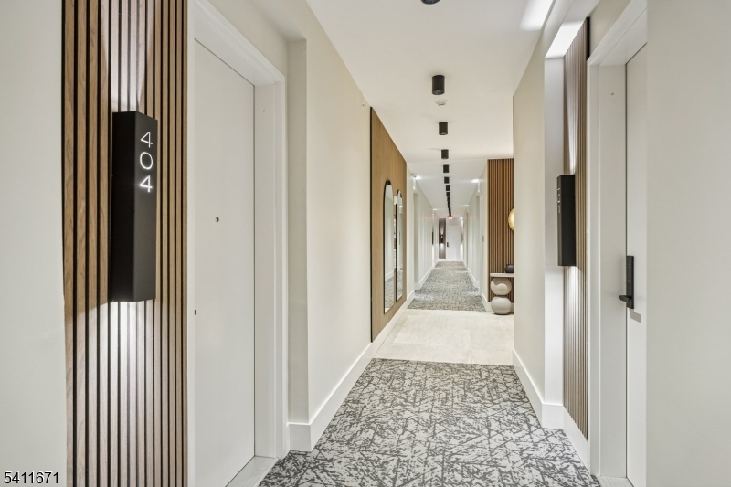 1722 Springfield Avenue, Unit 402 Maplewood, NJ 07040 - Photo 27 of 34 a view of a hallway with a white walls