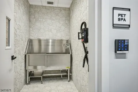 a bathroom with a shower sink vanity and toilet