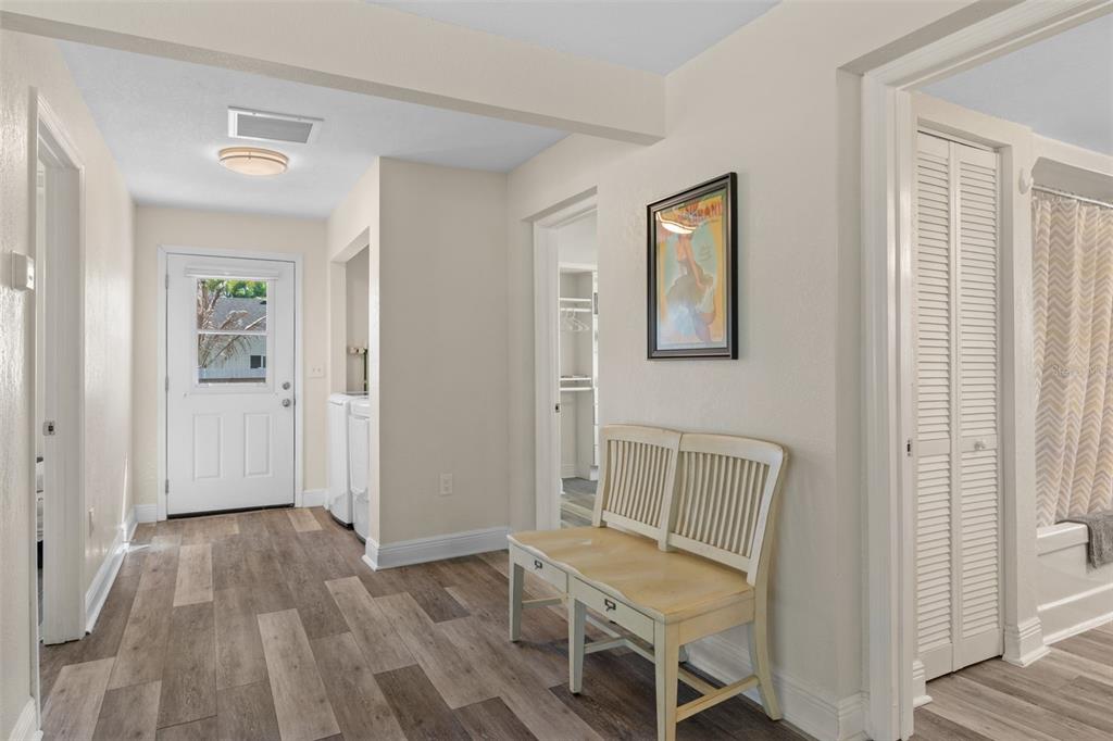 7272 Westwind Street Weeki Wachee, FL 34607 - Photo 20 of 33 a view of a livingroom with wooden floor and chair