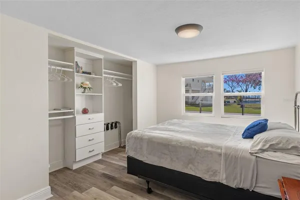 a bedroom with a bed and a cabinets