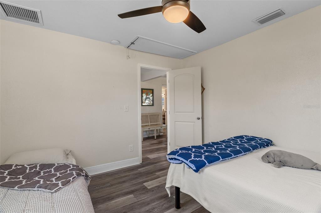 7272 Westwind Street Weeki Wachee, FL 34607 - Photo 24 of 33 a bedroom with a bed and dresser