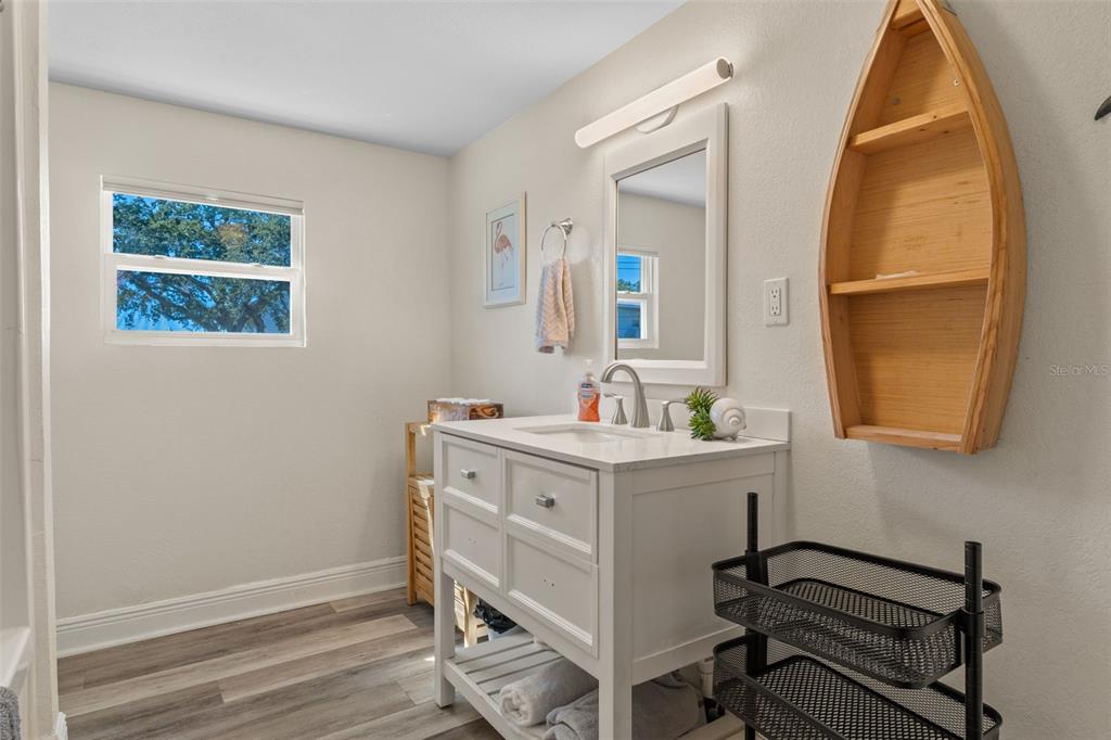 7272 Westwind Street Weeki Wachee, FL 34607 - Photo 25 of 33 a view of a workspace room with a window and wooden floor