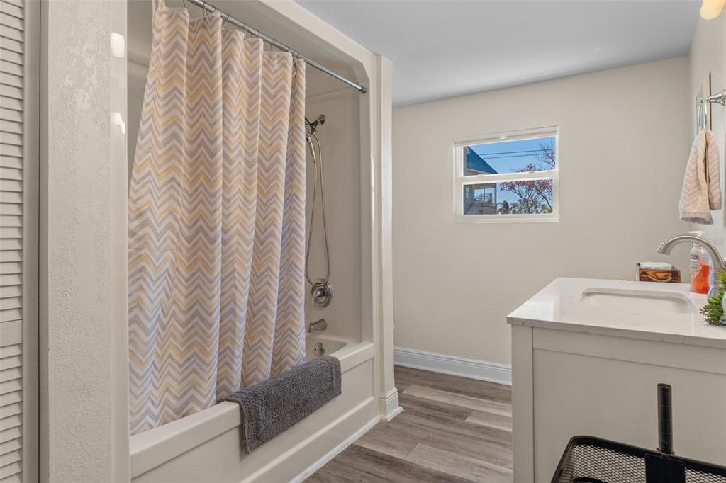 7272 Westwind Street Weeki Wachee, FL 34607 - Photo 26 of 33 a bathroom with a sink and a mirror