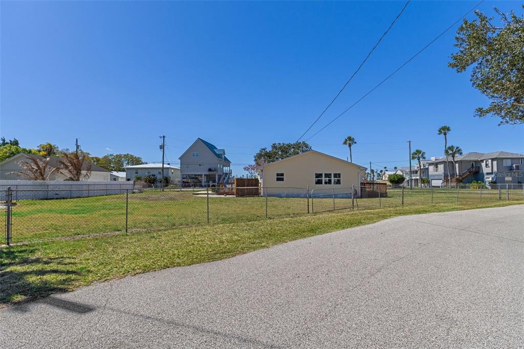 7272 Westwind Street Weeki Wachee, FL 34607 - Photo 33 of 33 a view of house with a big yard and potted plants