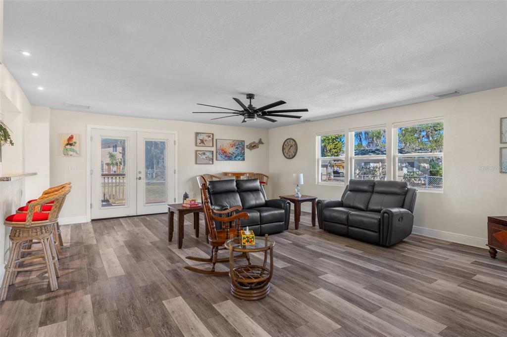 7272 Westwind Street Weeki Wachee, FL 34607 - Photo 8 of 33 a living room with furniture and wooden floor