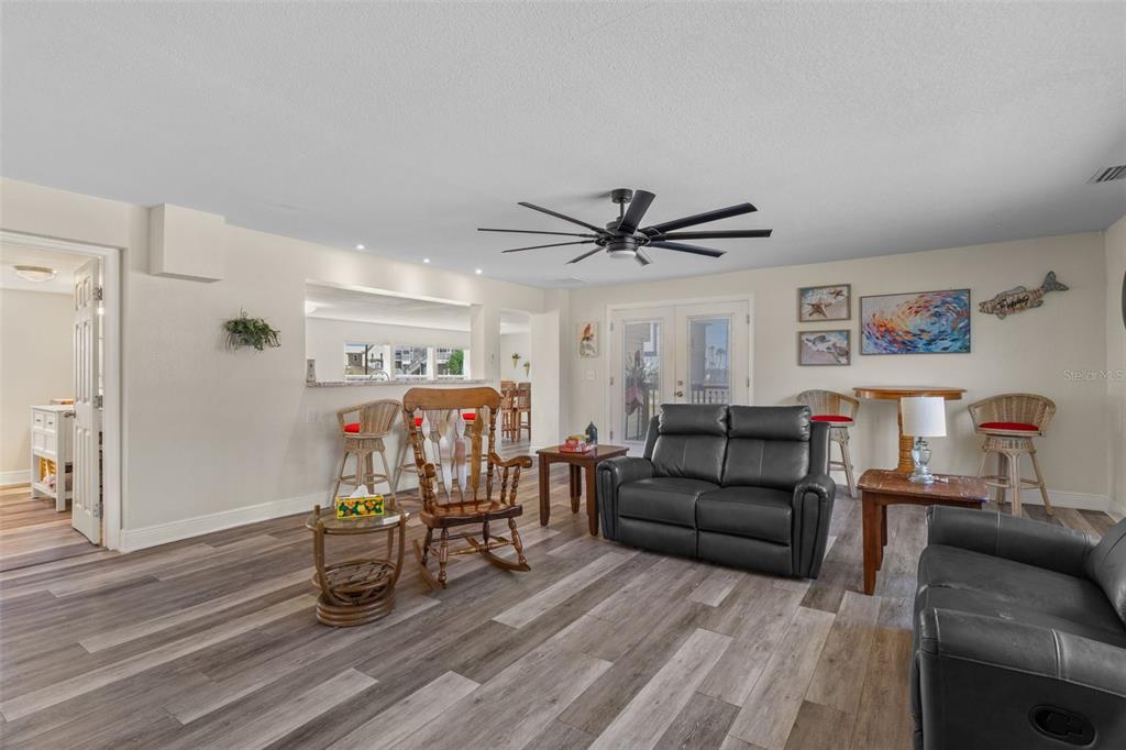 7272 Westwind Street Weeki Wachee, FL 34607 - Photo 9 of 33 a living room with furniture and a wooden floor